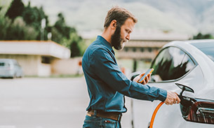 A man filling his car up with petrol