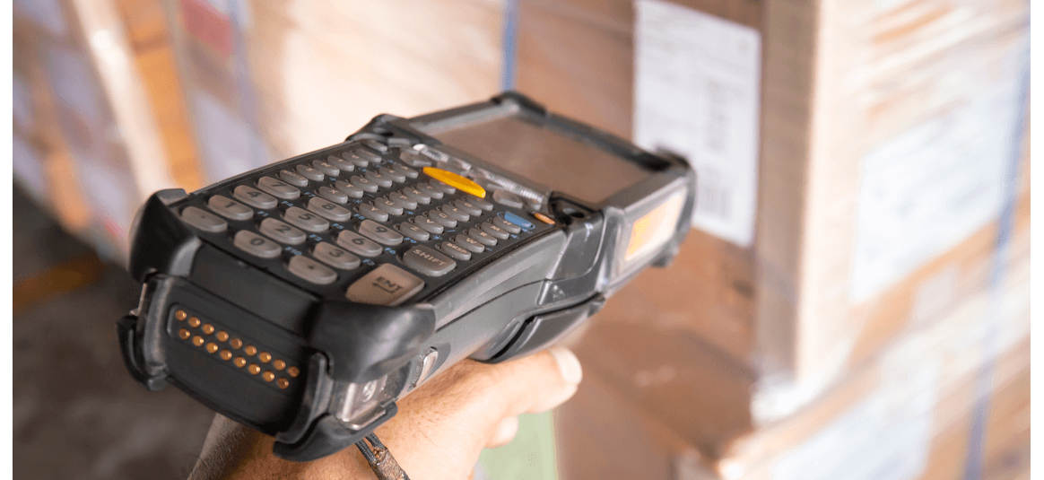 closeup hand worker holding barcode scanner