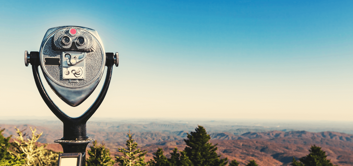 coin operated binoculars, looking out over a rugged landscape