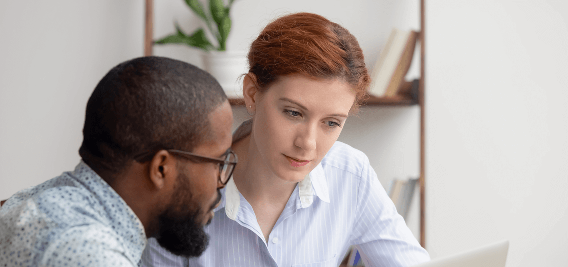 A man and a woman discussing business plans