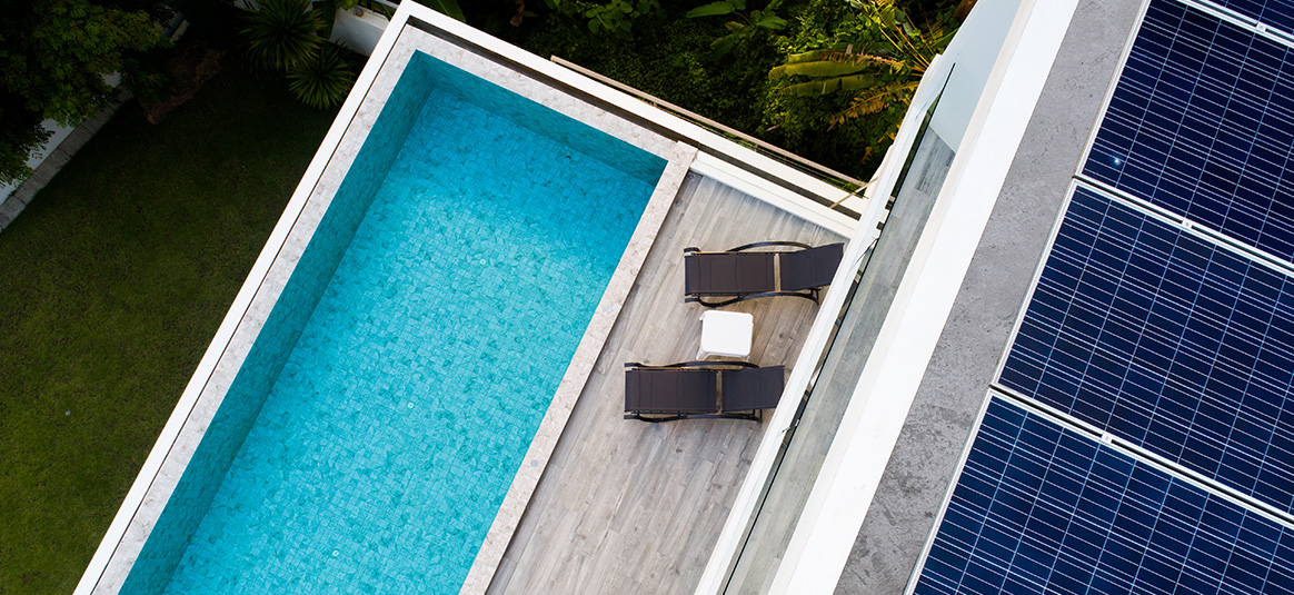 photo of swimming pool and solar panels