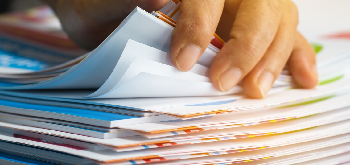 Close up of hand with documents