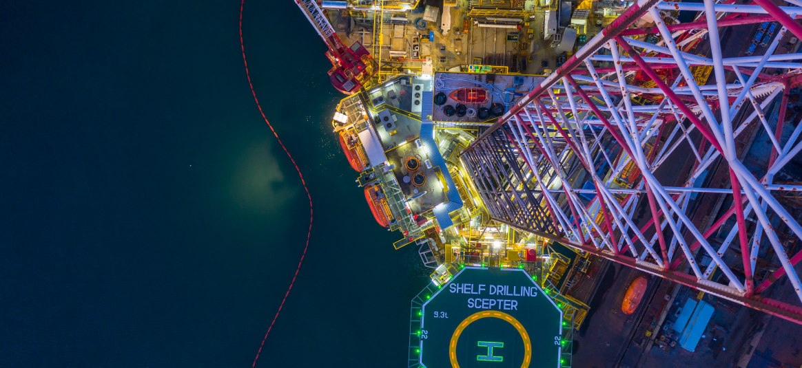 An aerial view of oil drilling platform with helipad