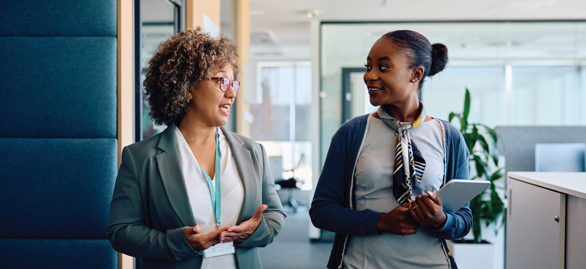 Two lawyers standing, having a conversation