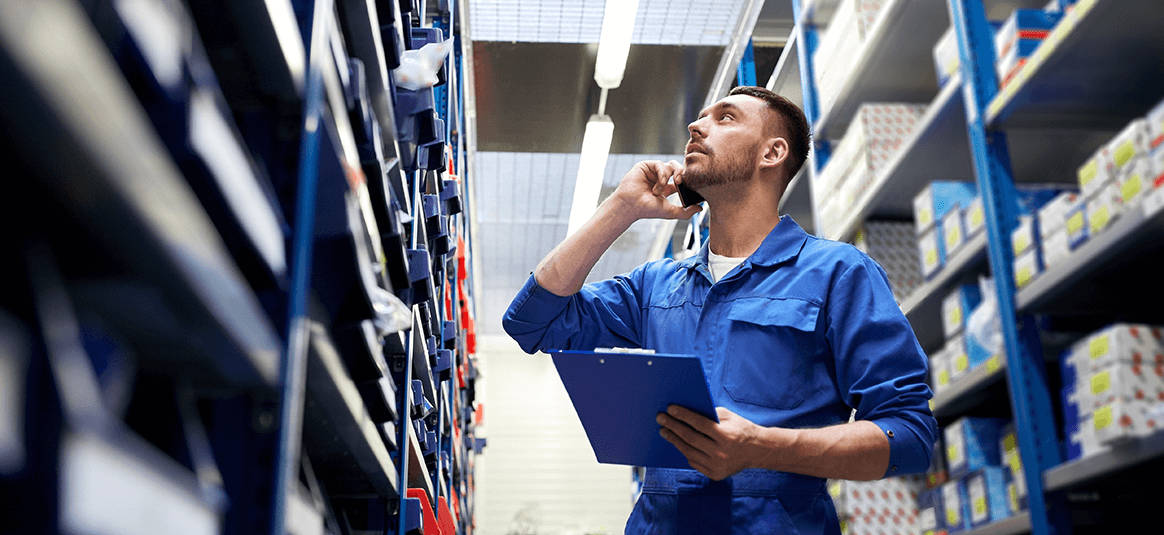 Man taking a stock review in a warehouse