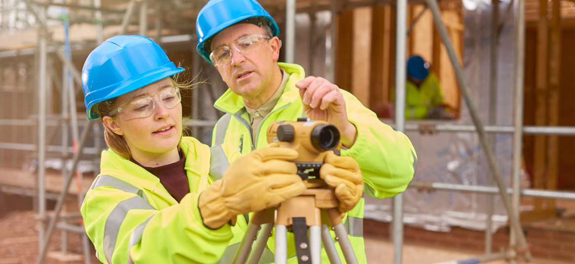 Photo of two people on construciotn site