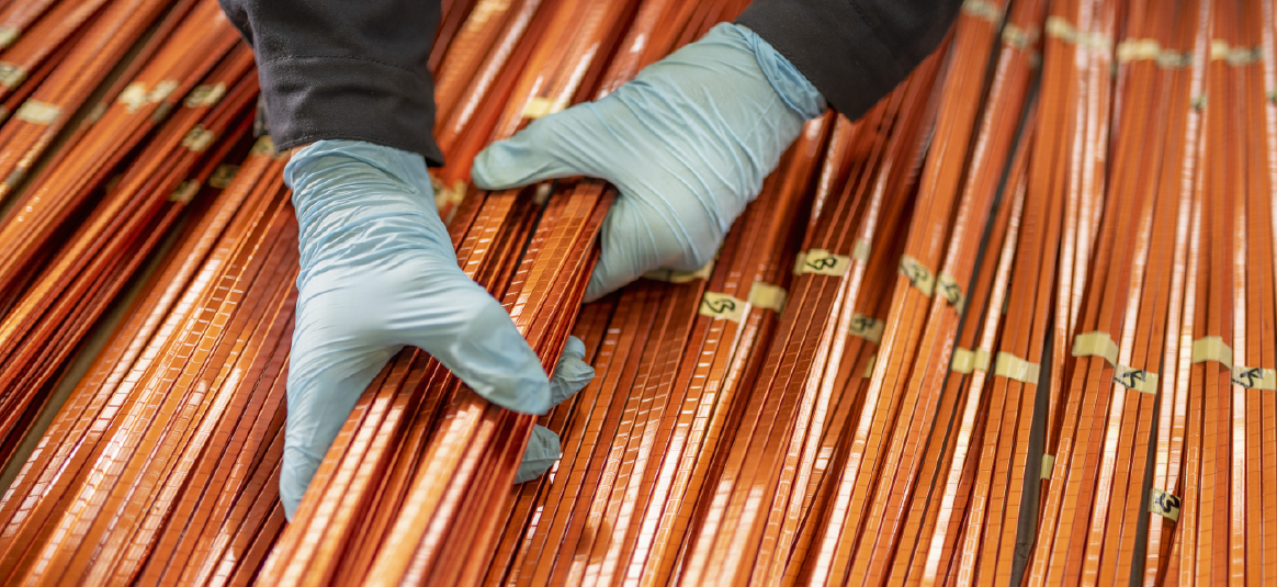 Person handling copper strips