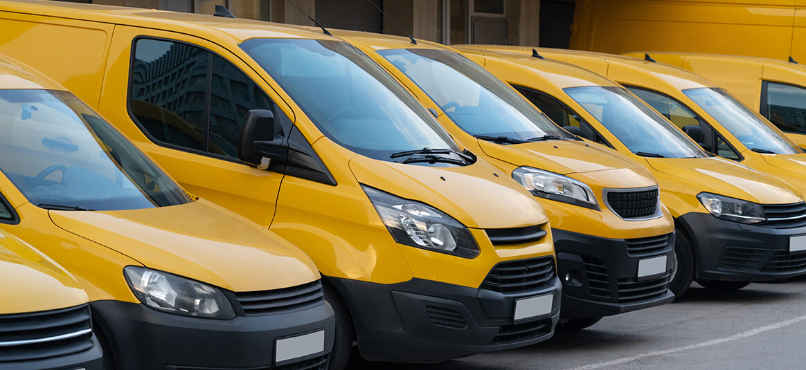 A fleet of yellow vans