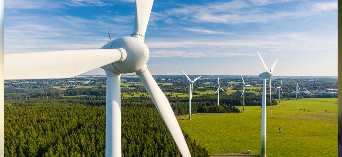 A wind farm located in green meadows