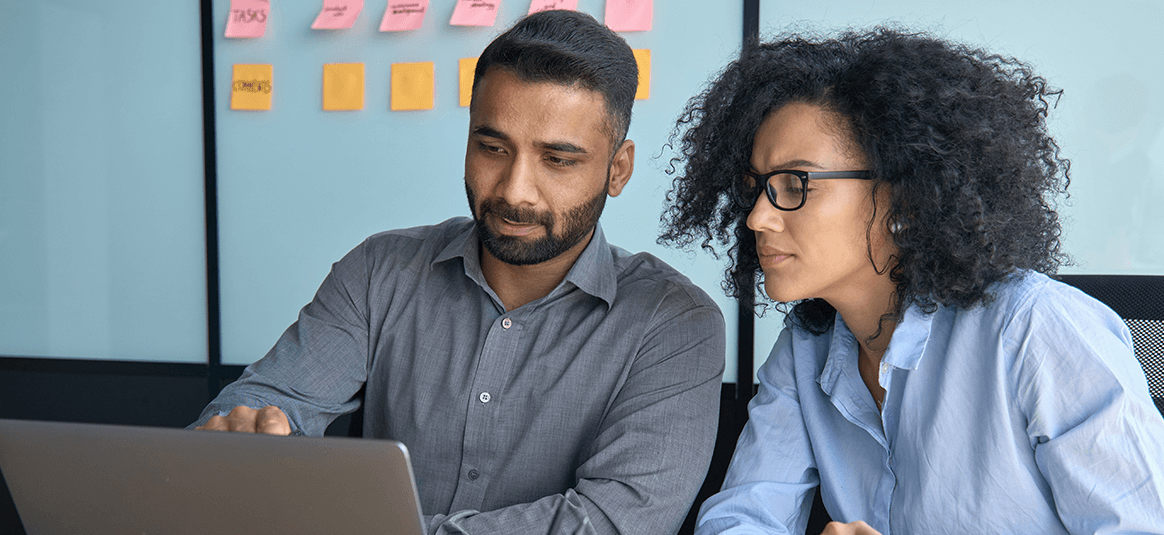 Colleagues working together on a laptop