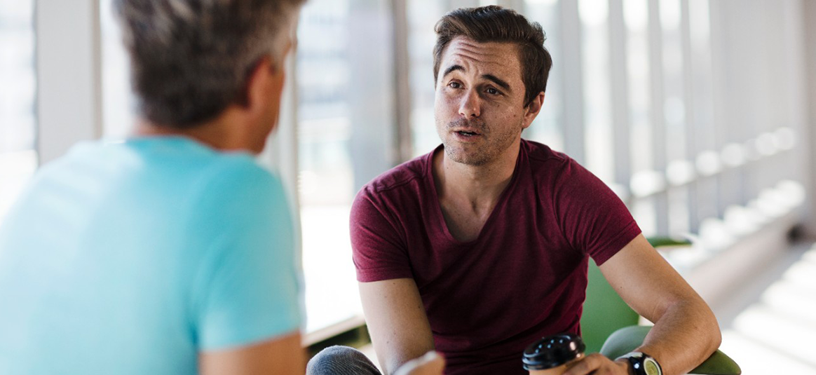 Photo of two people talking
